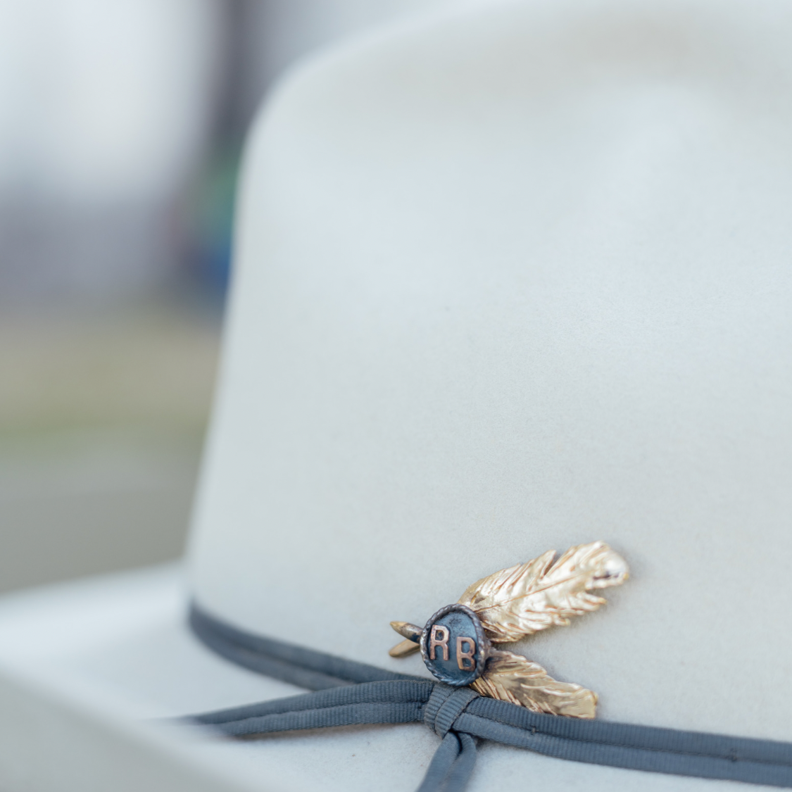 Coyote Creek hat with RB feather pin